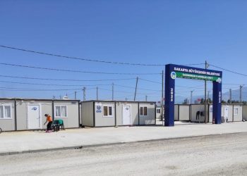 Displaced earthquake victims move into new container house village